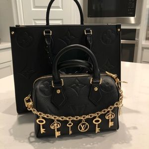 Brand new Louis Vuitton FORNASETTI KEYCHAIN GOLD BAG CHARM